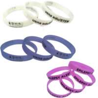 UV-sensitive wristbands changing to purple and blue, showcasing debossed and silkscreened logos.